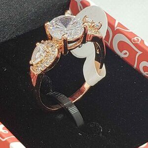 18k rose gold plated ring with cubic zirconia stones and 3 gemstones